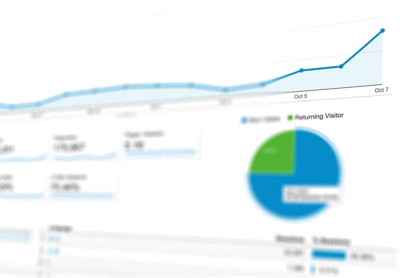 our-experience Abstract visualization of data analytics with graphs and charts showing dynamic growth.